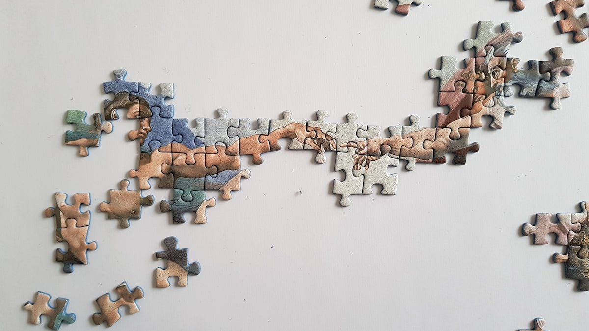 a group of pieces of a puzzle on a wall