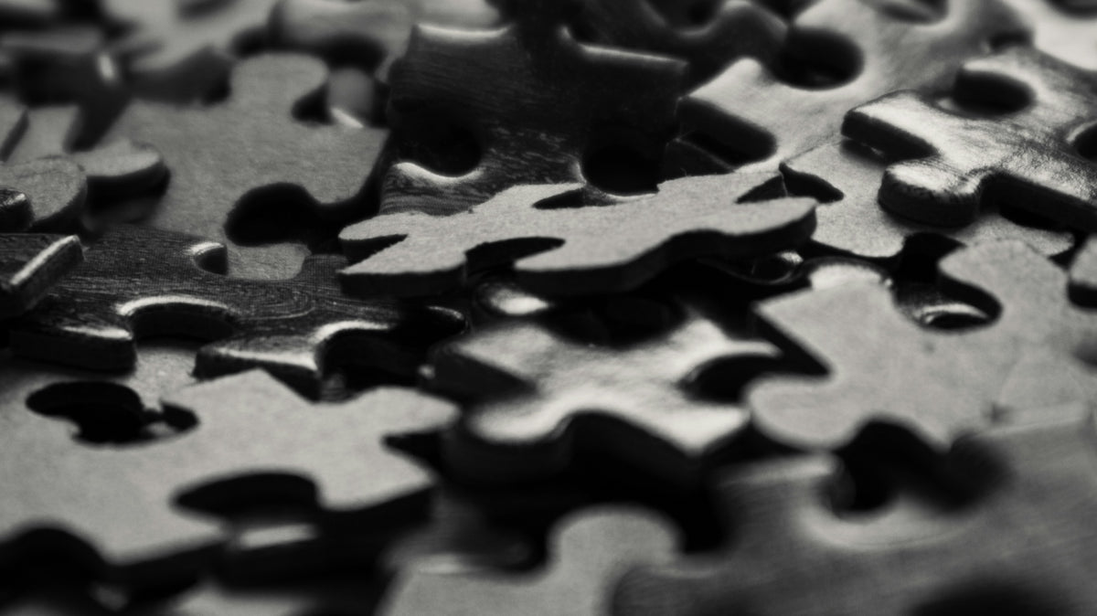 a black and white photo of a puzzle piece