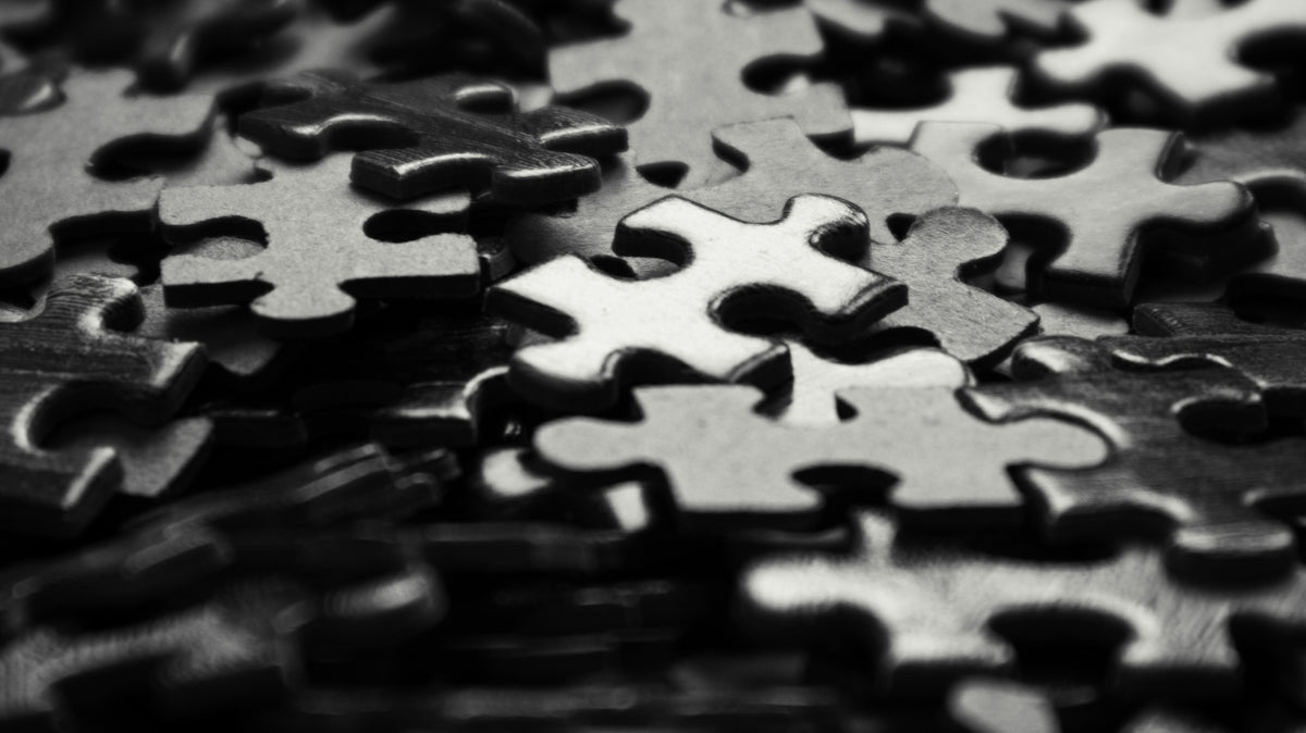 a black and white photo of a puzzle
