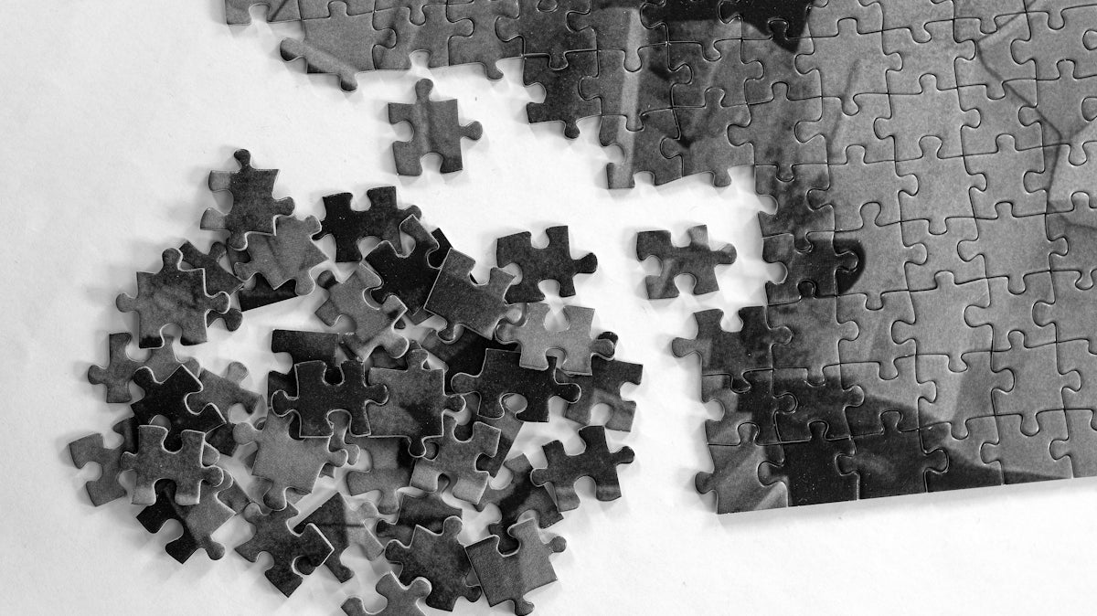 a black and white photo of a puzzle