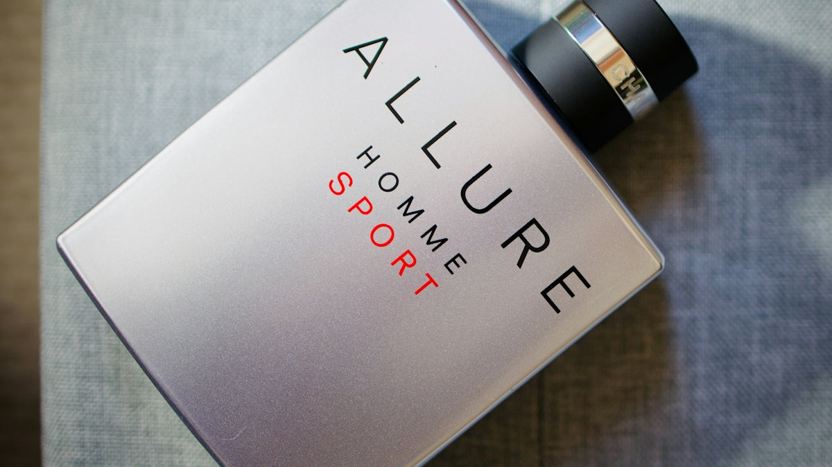 Chanel allure homme sport cologne bottle on gray surface