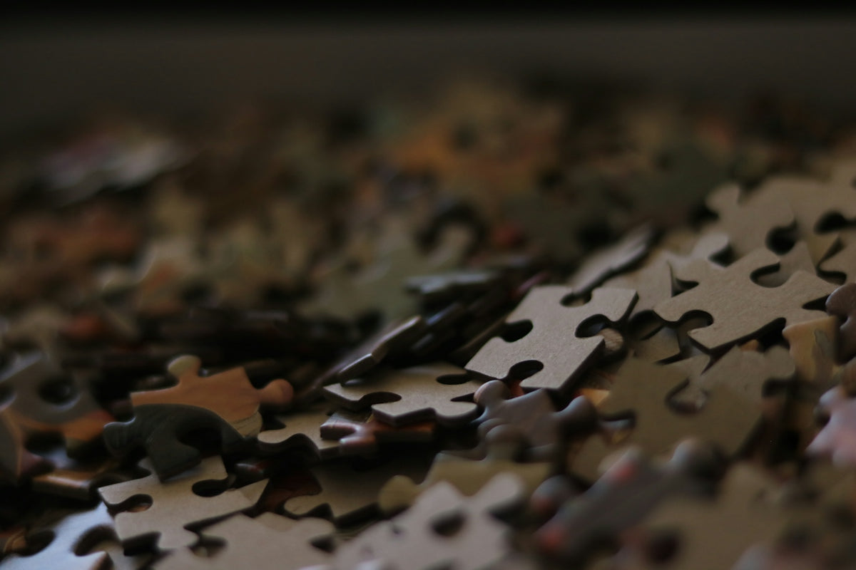 Pile of scattered jigsaw puzzle pieces