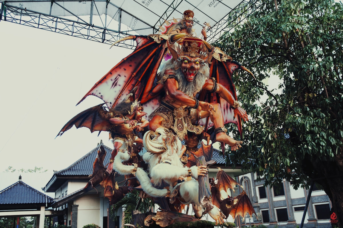 Intricate statue of mythical creatures with demonic figures.